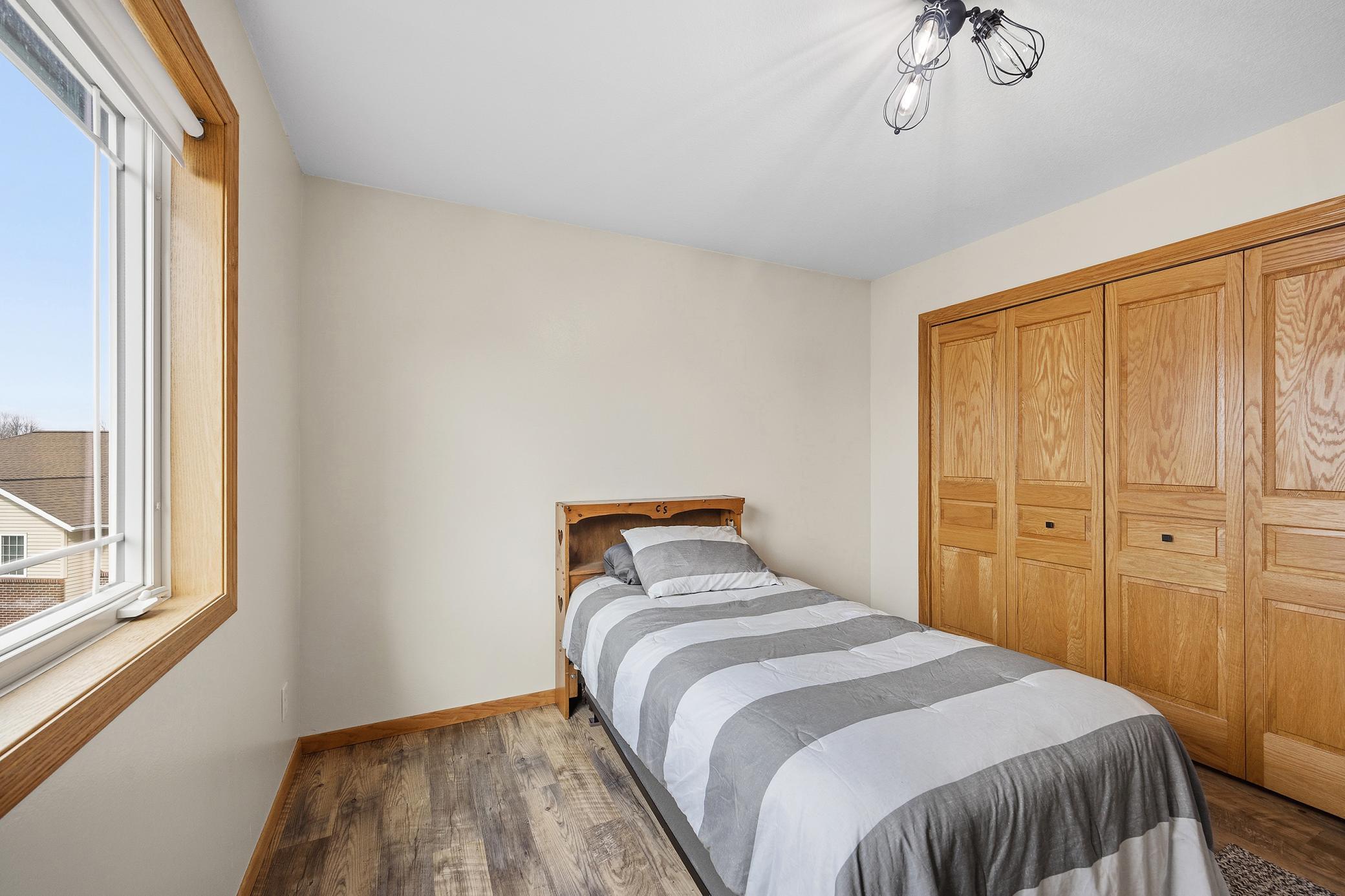 3rd bedroom upstairs with consistent flooring throughout