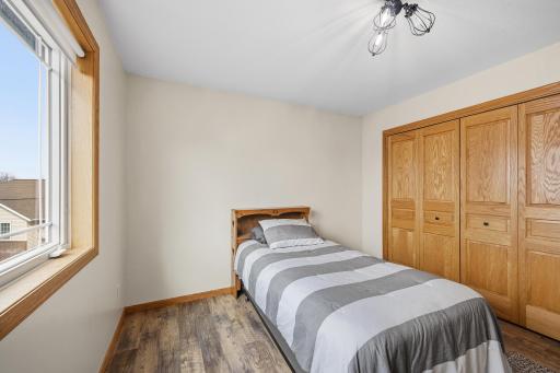 3rd bedroom upstairs with consistent flooring throughout