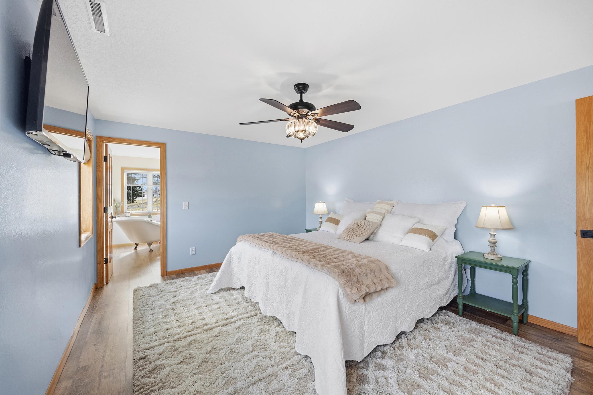 Primary bedroom with an abundance of natural light