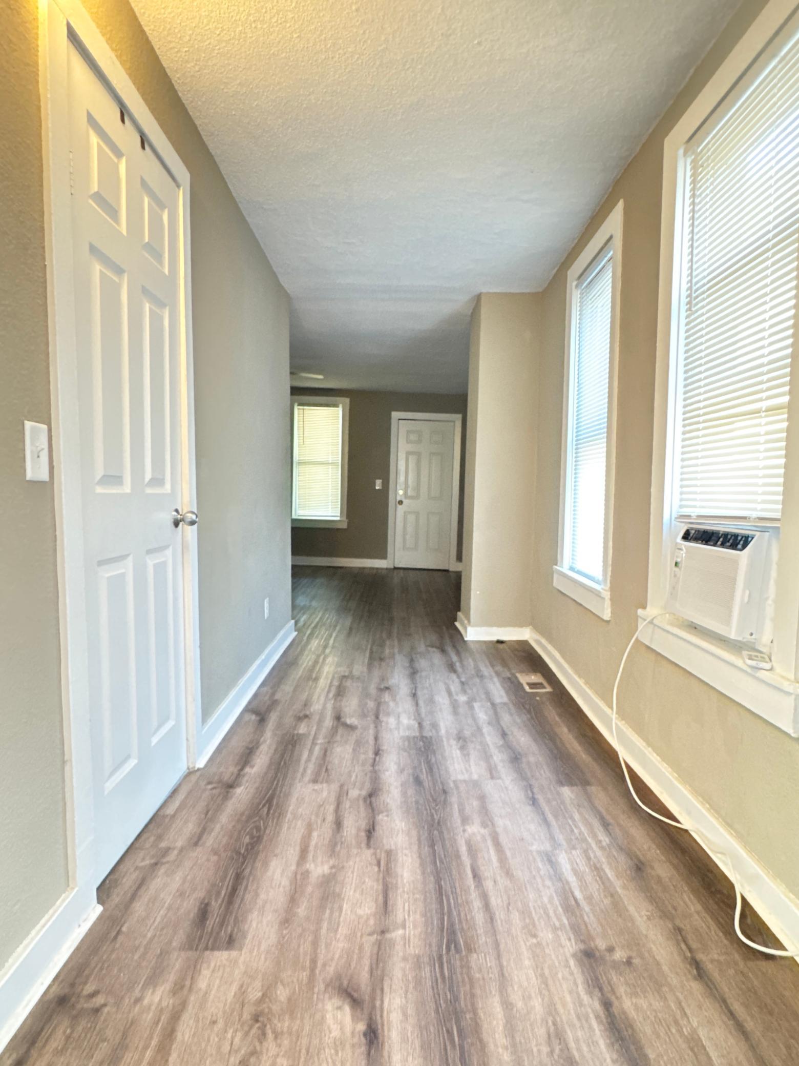 Natural light carries throughout the main level, creating a bright and welcoming feel.