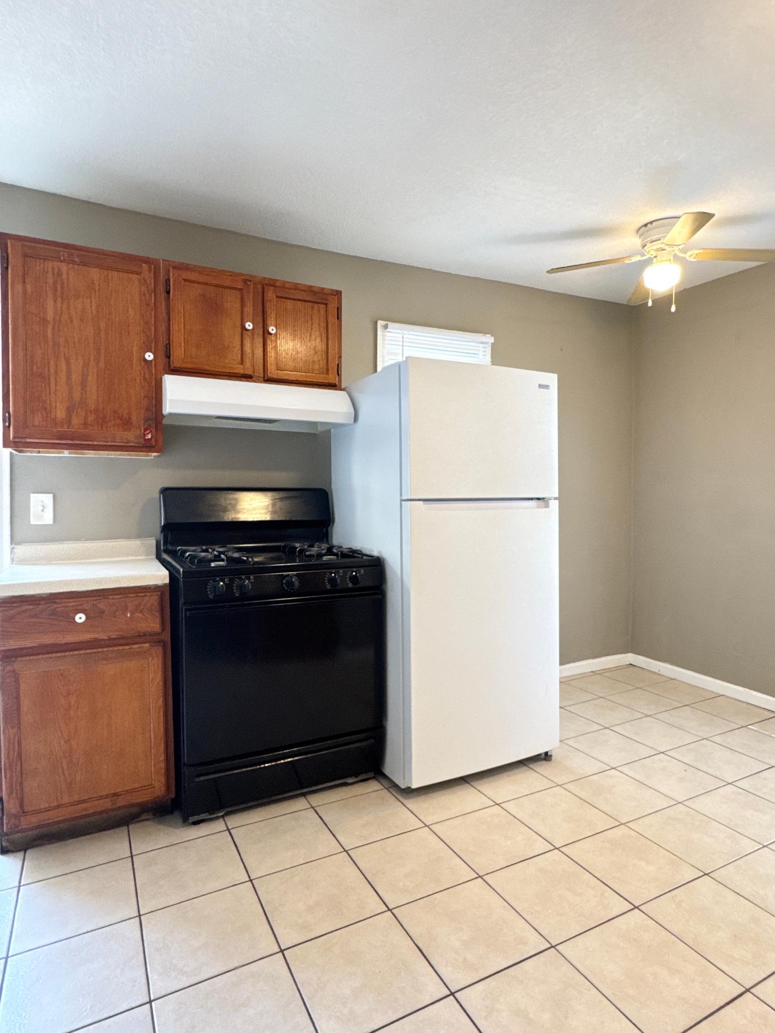 Functional kitchen with plenty of cabinet storage and room for everyday meal preparation.