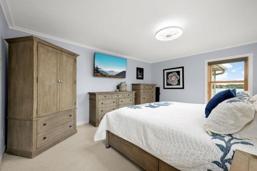 Main-floor bedroom updated with crown molding, trim, new doors and paint.