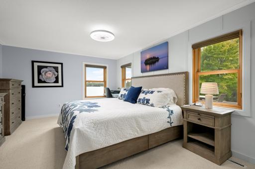 Main-floor bedroom updated with crown molding, trim, new doors and paint.