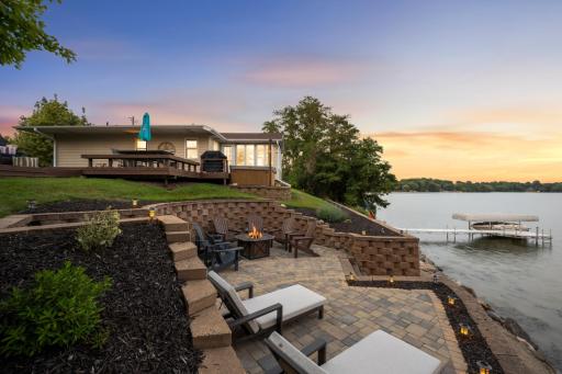 Luxurious paver patio added in 2024, featuring stunning stonework that truly elevates the outdoor living and entertaining space.