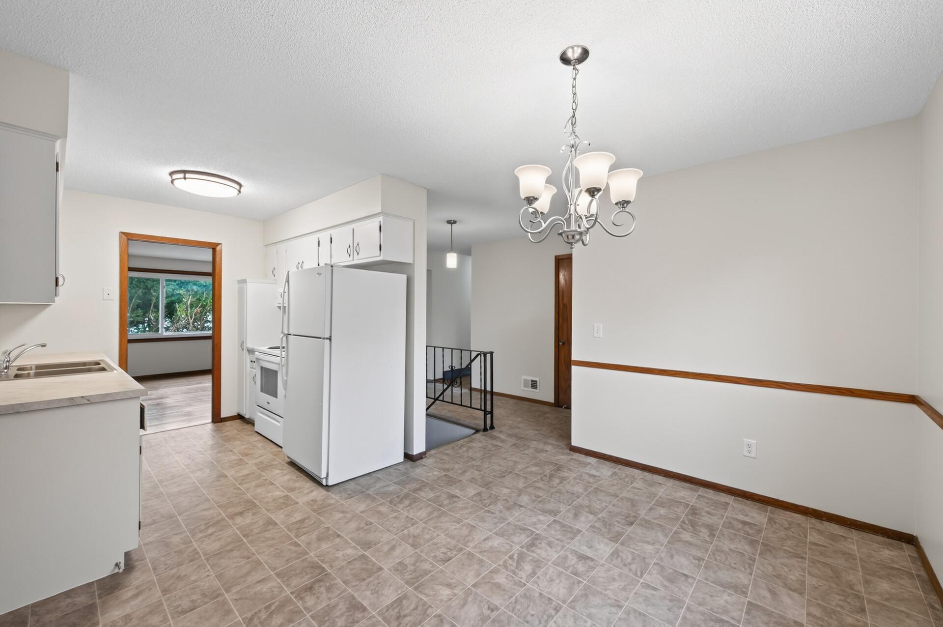Open flow from dining room into kitchen and living room areas.