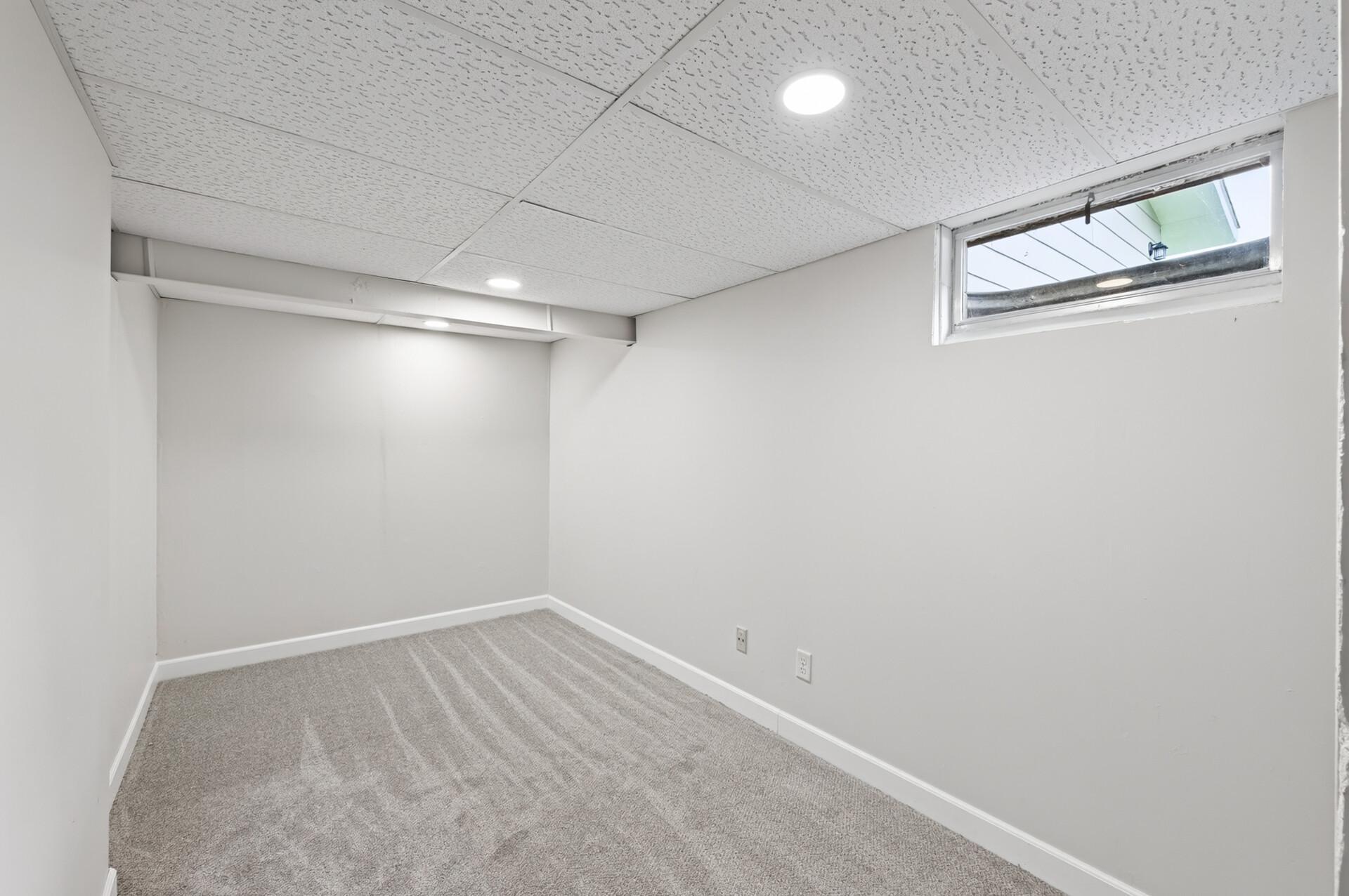 Lower level office area with new carpet and bright fresh paint.