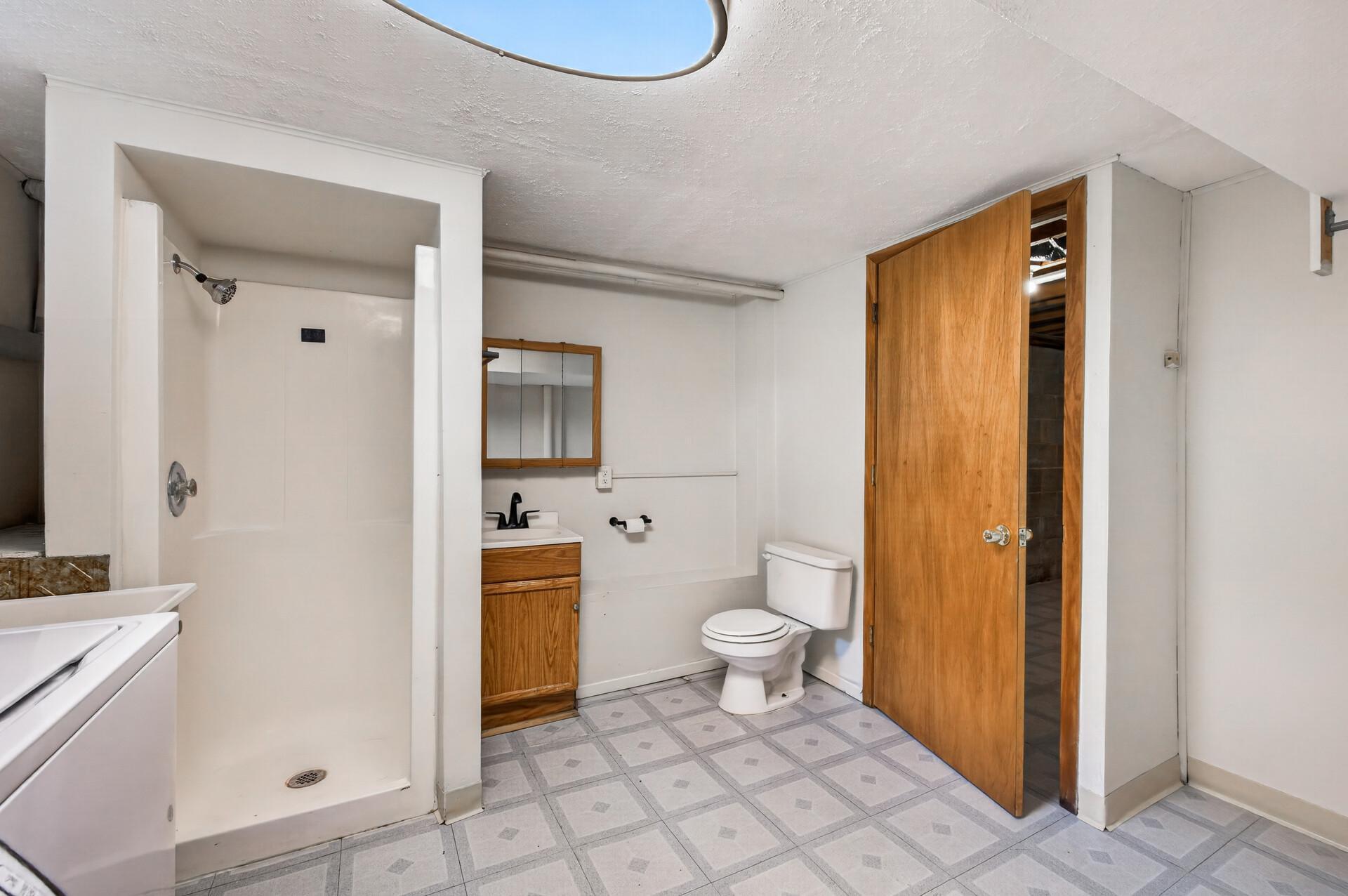 Lower level bathroom offers convenience.