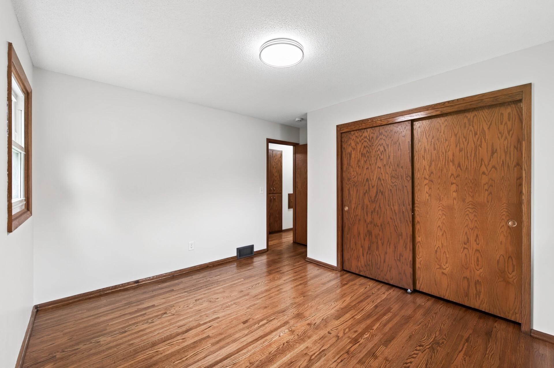 Relaxing primary bedroom with double closet.
