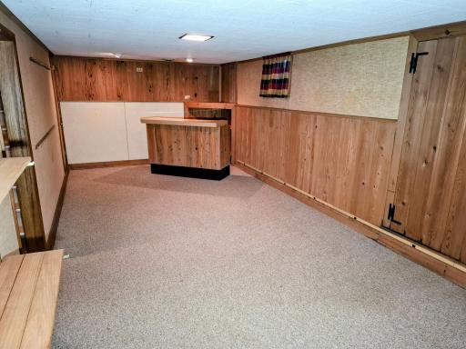 View II of lower-level family room.