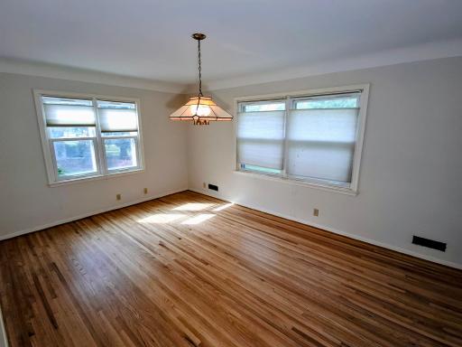 Living room with gleaming hardwood floors.