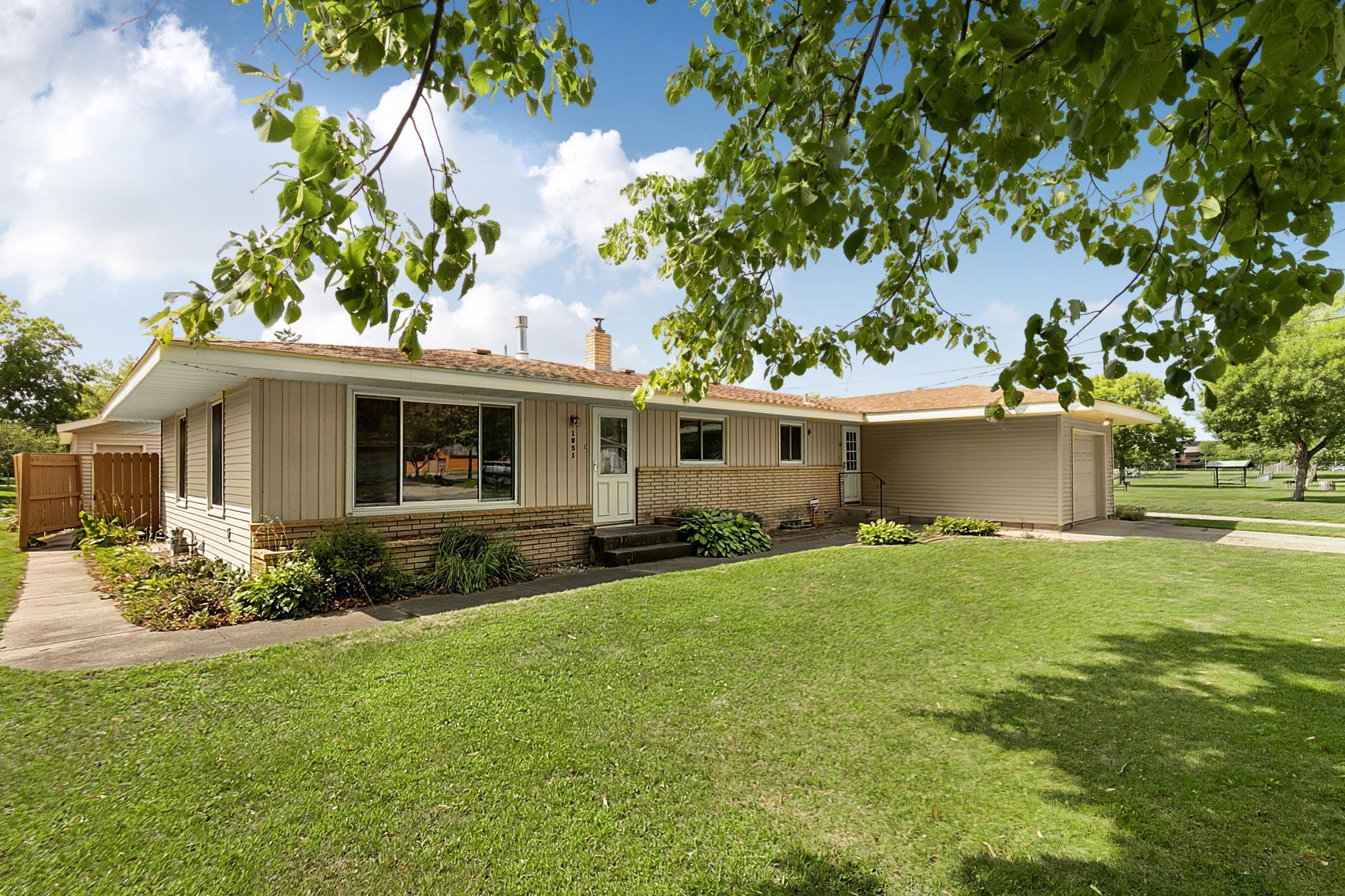 Welcome to a well-cared-for home that makes a lasting first impression with durable steel siding and brick accents across the front of the home, complemented by a raised brick-accented flower bed.