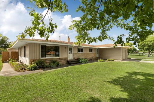 Welcome to a well-cared-for home that makes a lasting first impression with durable steel siding and brick accents across the front of the home, complemented by a raised brick-accented flower bed.