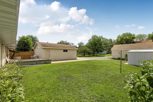 Architectural shingles, seamless rain gutters with leaf guards, and a concrete driveway add to the home's practicality and ease of maintenance.