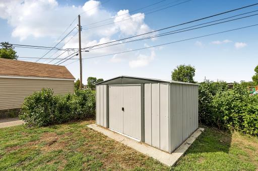 The 8' x 10' accessory shed is situated on its own concrete pad.