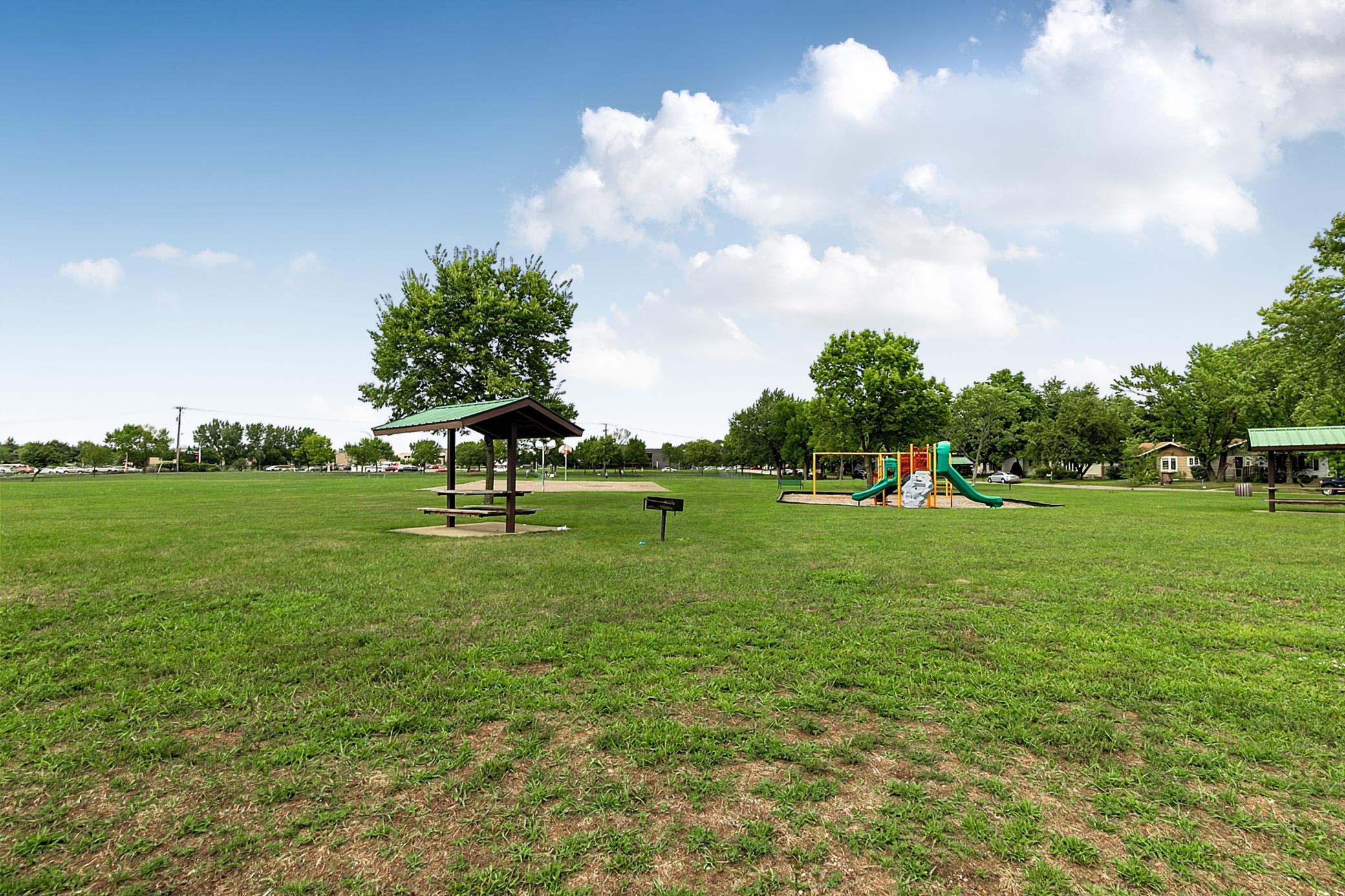 Whether enjoying the backyard garden, relaxing by the fireplace, working in the detached garage, or simply stepping across the street to the city park, this property offers plenty of ways to make the most of everyday living.