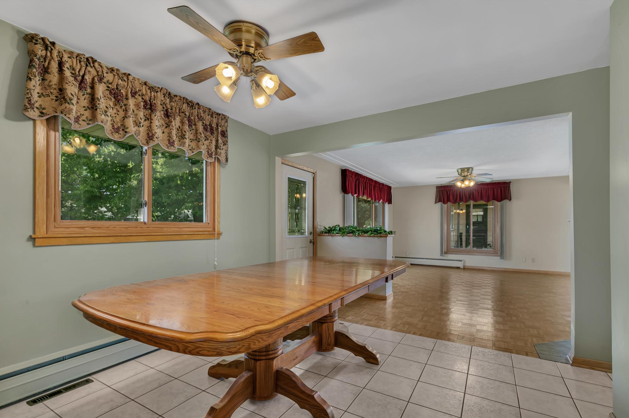 Large dining room off the kitchen with tiled flooring for easy cleanup.