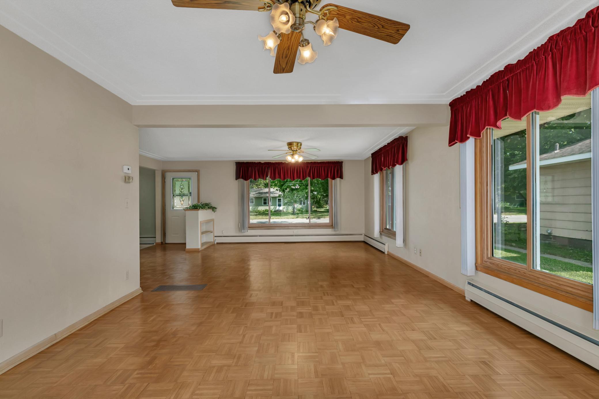 Ceiling fans are located in both the living room and dining room.
