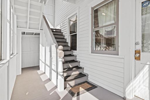 Sun filled, shared back porch leading to upper unit
