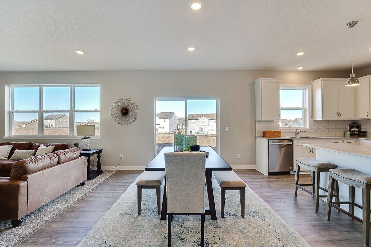 The kitchen space leads straight into the dining area, which stretches 17-feet across and leaves enough space to accommodate any dining table configuration! Photo of model, colors and options will vary.