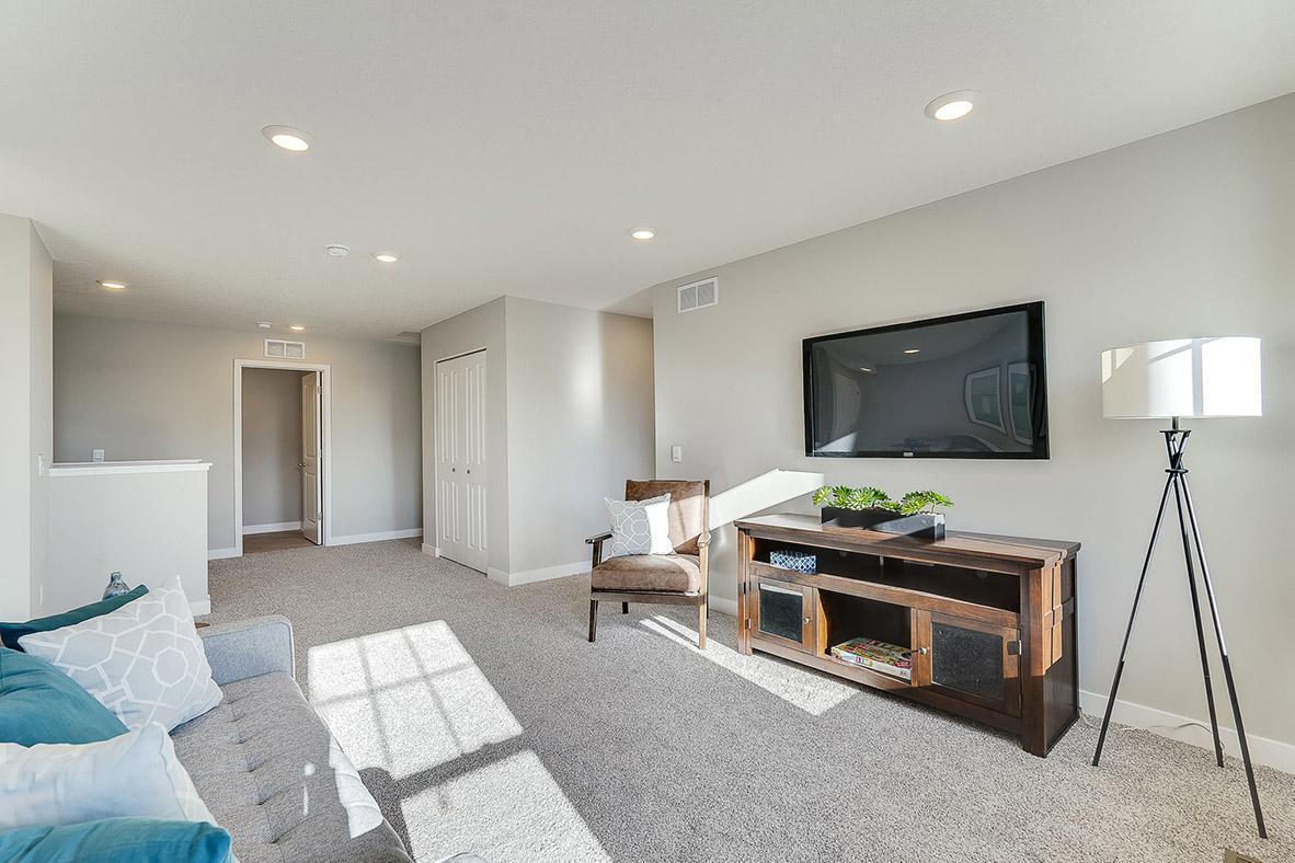 Once upstairs, the entire level flows from the focal point offered by this huge loft space. Sure to become a family favorite hangout spot! Photo of model, colors and options will vary.