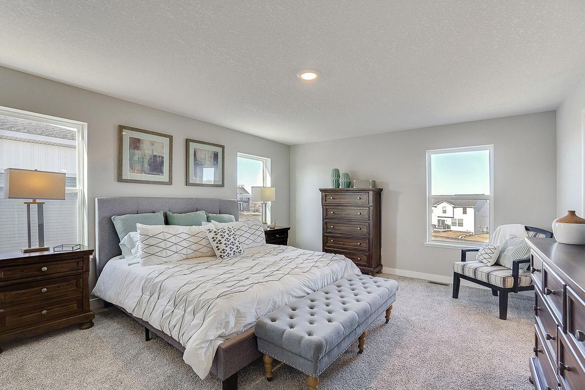 An oasis on it's own, the home's primary suite is awesome and loaded - including immediate access to a MASSIVE walk-in closet as well as a private bath that is equally appointed with features. Photo of model, colors and options will vary.