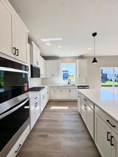 Welcome to the Adams Floorplan. This floorplan boasts a 7ft island and the largest primary closet we offer. A must see. Now COMPLETE!