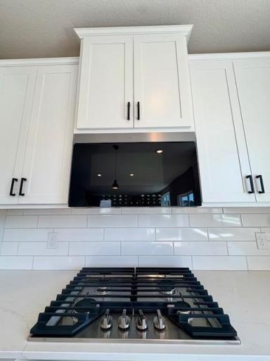 Upgraded Signature Kitchen includes double wall ovens, gas cooktop, and the latest microwave which includes an air fryer!