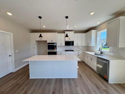 Upgraded Signature Kitchen includes double wall ovens, gas cooktop, and the latest microwave which includes an air fryer!