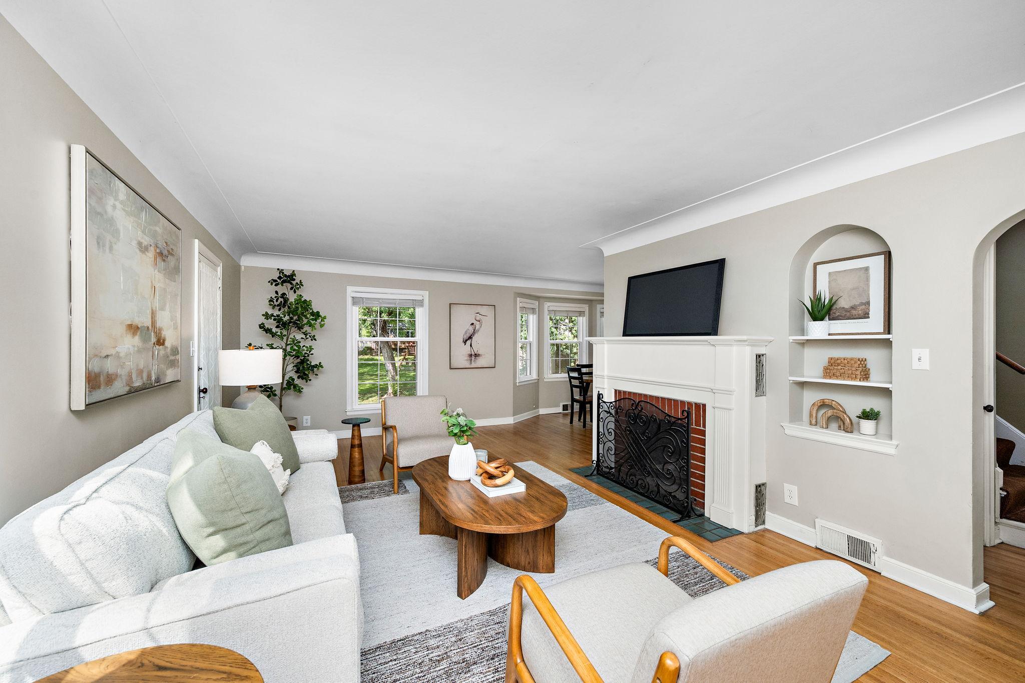 Hardwood floors, coved ceiling, and a brick fireplace!