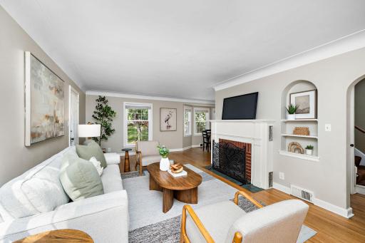 Hardwood floors, coved ceiling, and a brick fireplace!