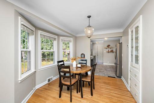 Nice dining space with plenty of natural light and a built-in cabinet!