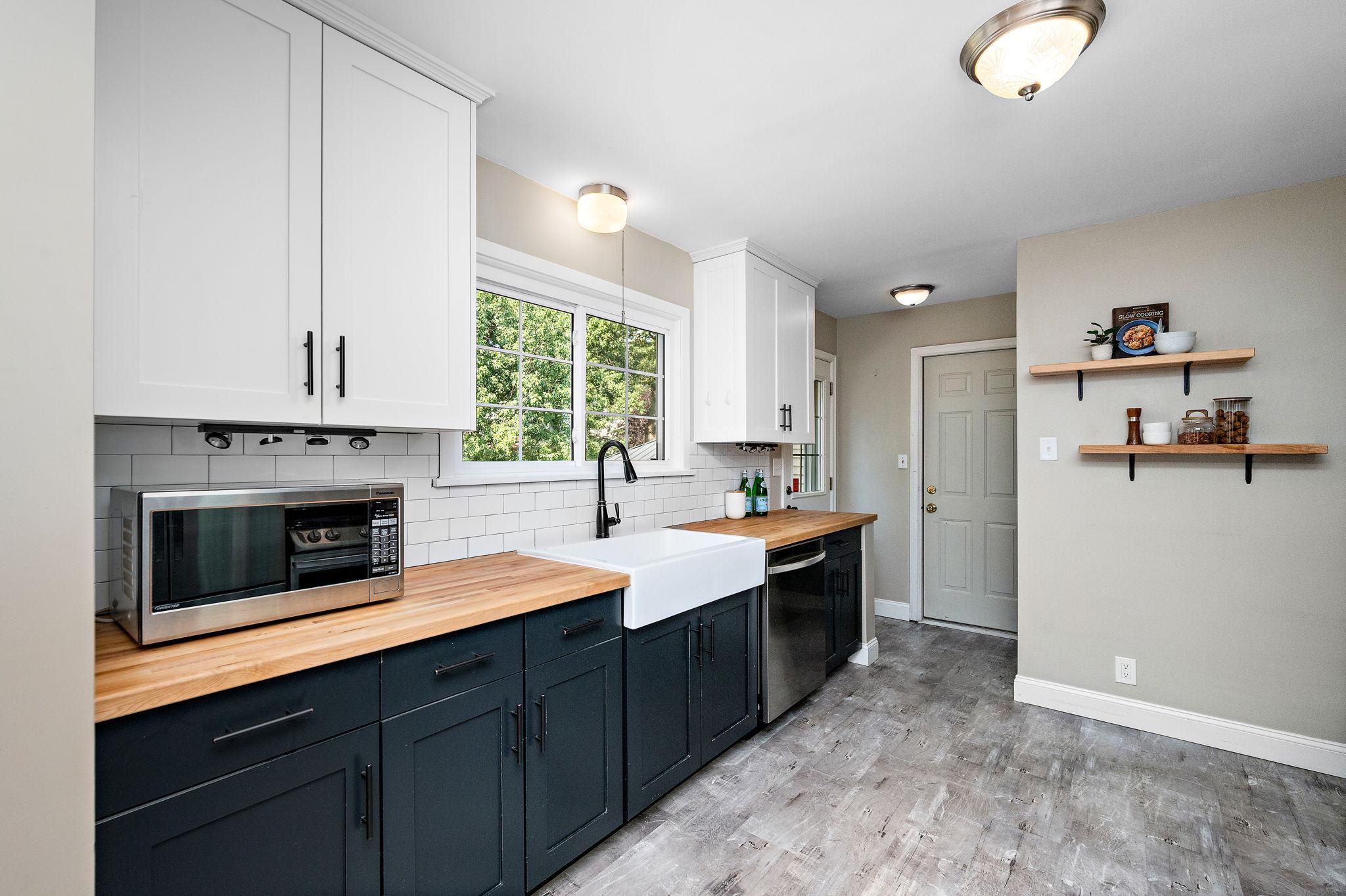 The kitchen leads to the mudroom and garage or to the backyard!