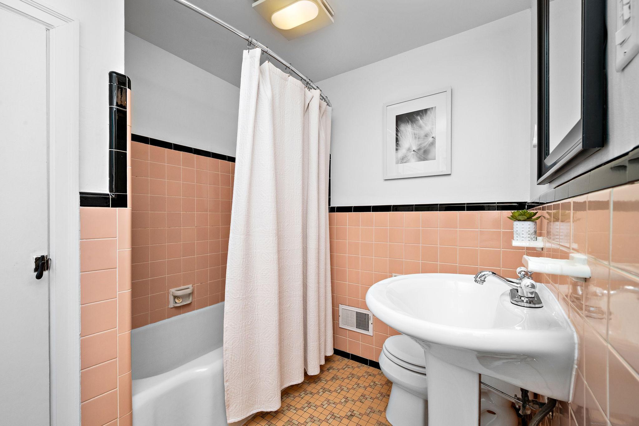 Vintage bathroom with large linen closet!