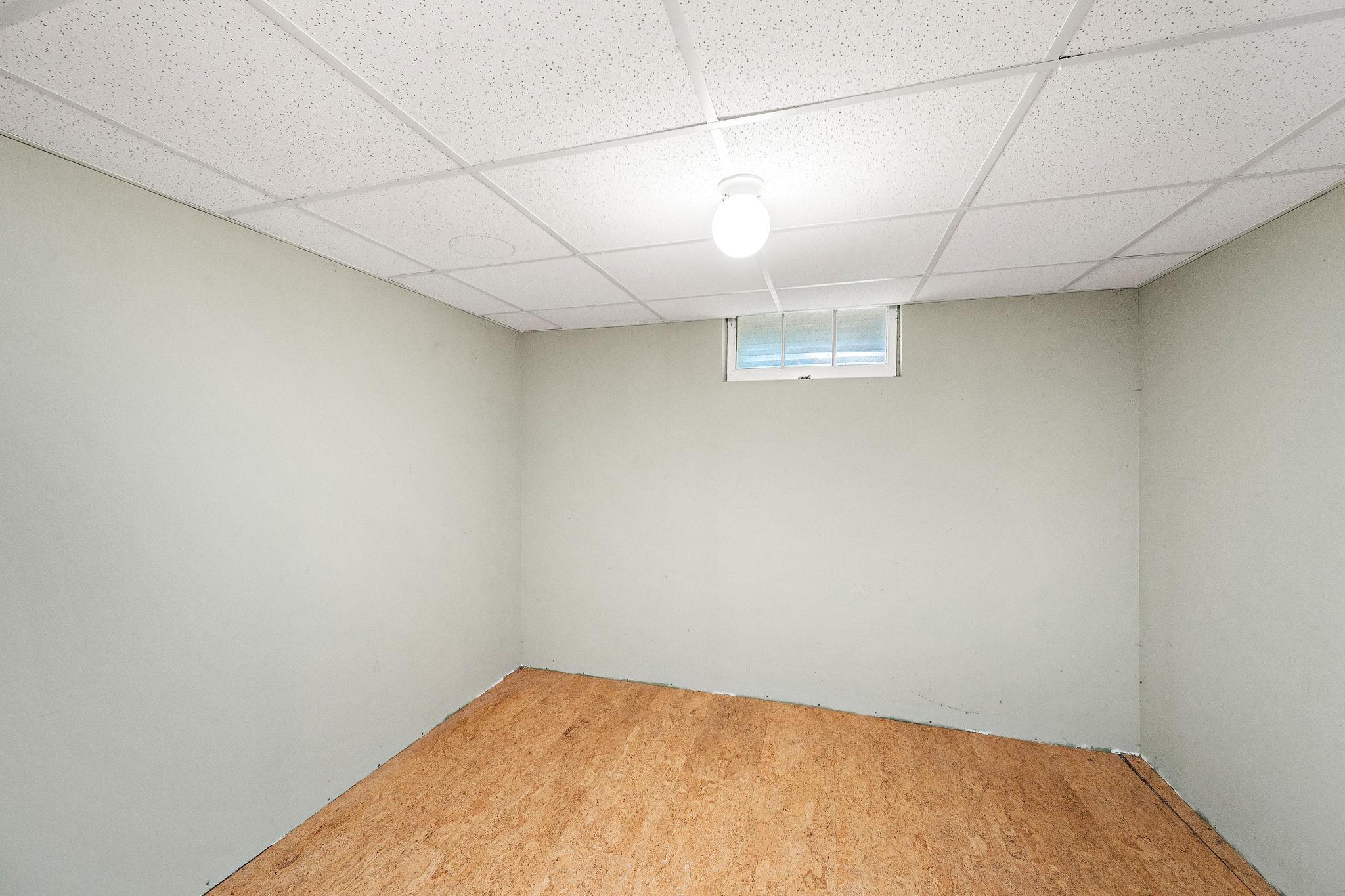 Great finished storage space, workout room, or another office option!