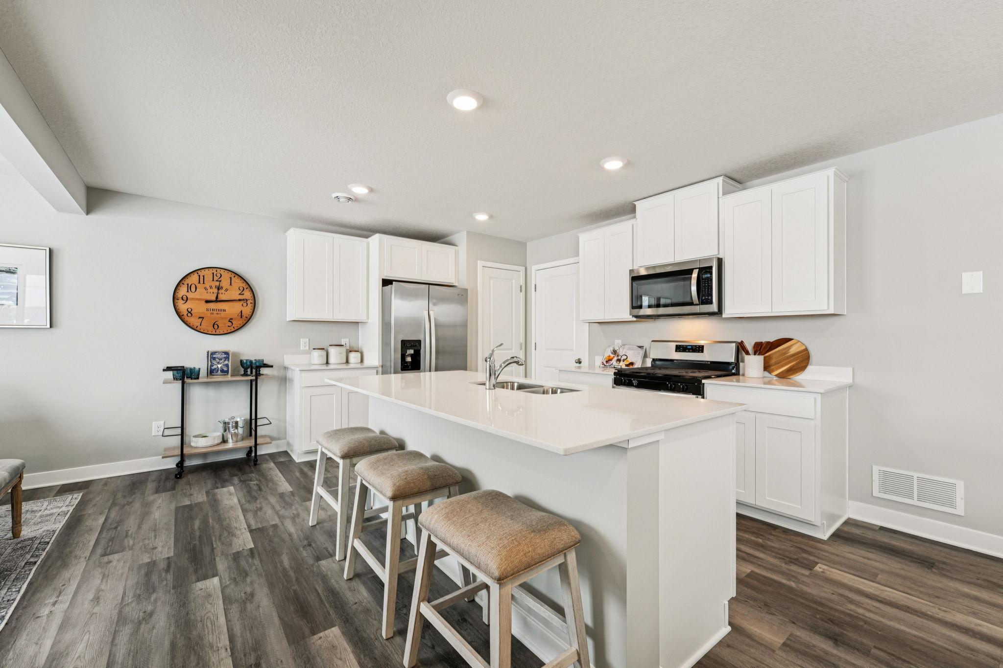 Another view of the Kitchen. Photo of model home, color & options will vary.
