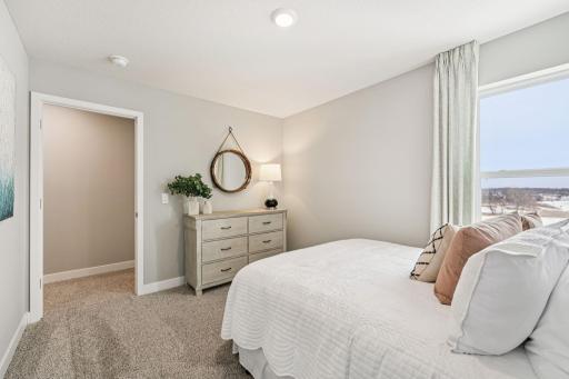 All four bedrooms upstairs are spacious and bright! Photo of model home, color & options will vary.
