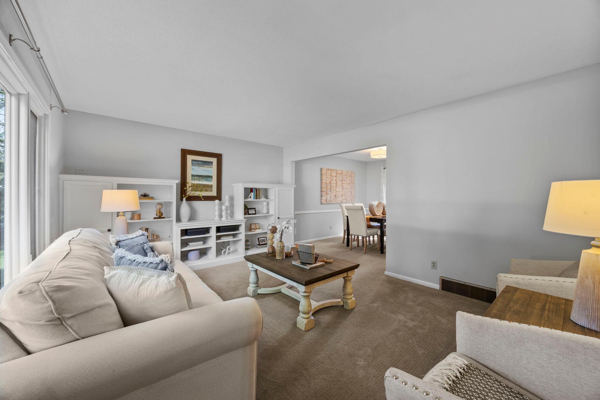 Full wall of built-ins and an entertainment center, creating a natural focal point while offering plenty of space to display decor, books, and everyday essentials.