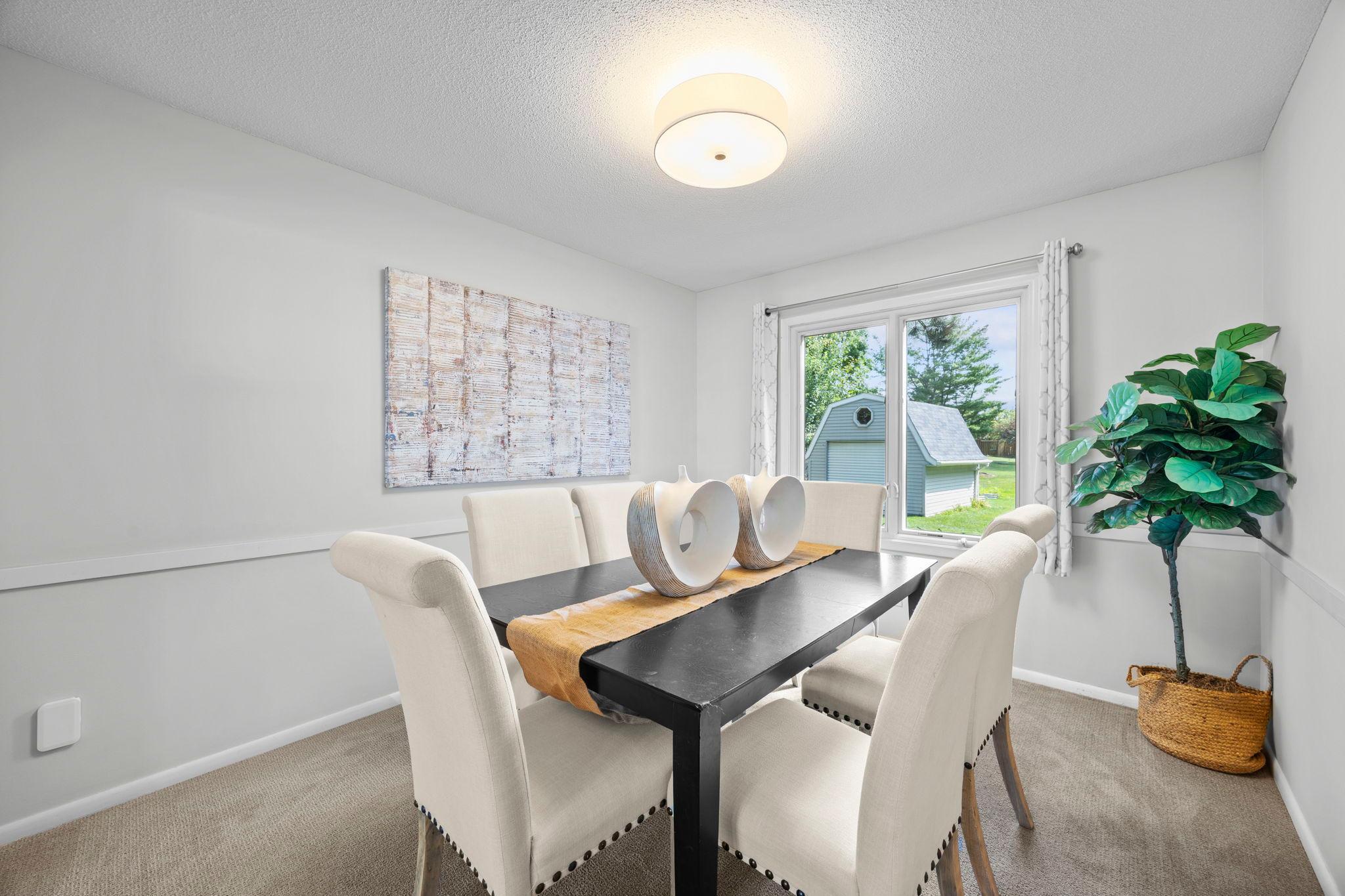 Trimwork in the adjoining formal dining room gives the space a more finished, traditional feel.