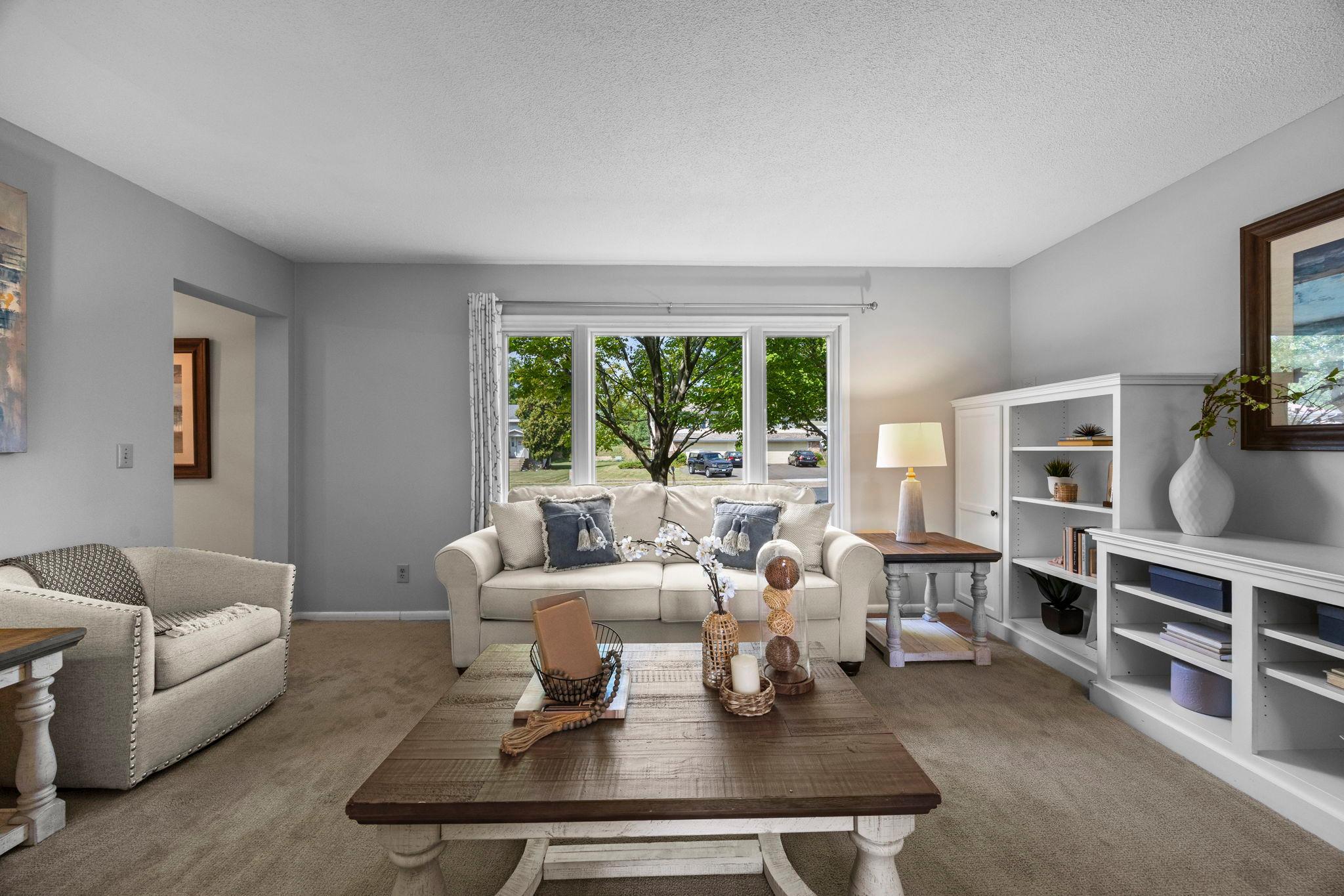 Large windows bring in peaceful views of the yard, adding a pleasant connection to the outdoors.