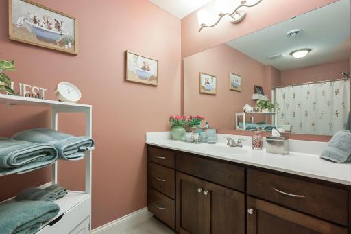 Spacious bath across from bedrooms on lower level.