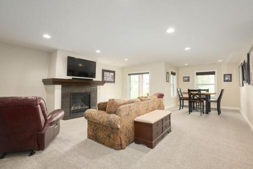 Lower level family room with gas fireplace and walkout to patio area.