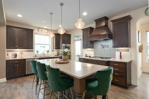 Custom cabinetry and tile work make this kitchen a true stand-out.
