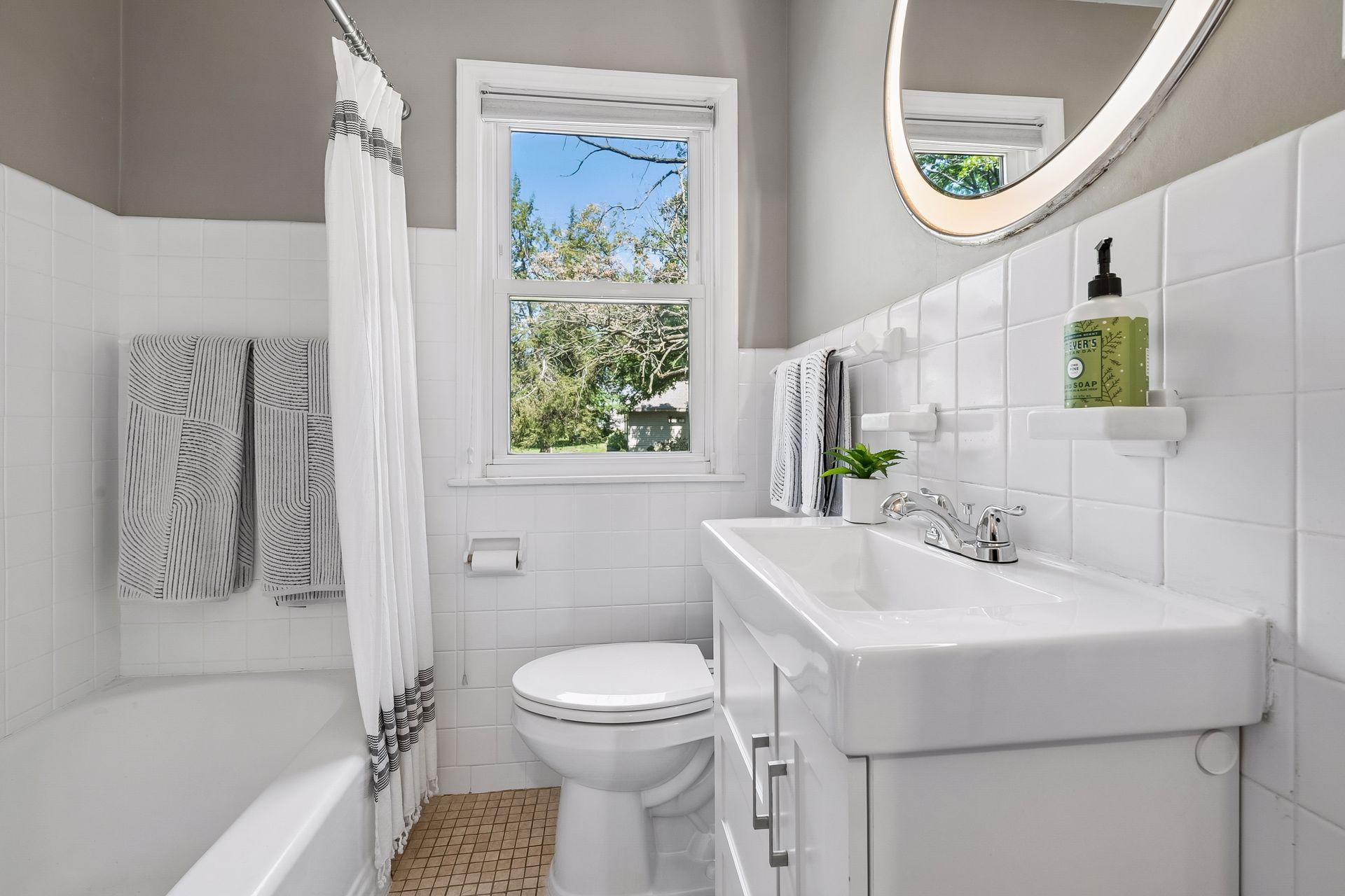 Main Floor Full Bathroom with North-facing window.