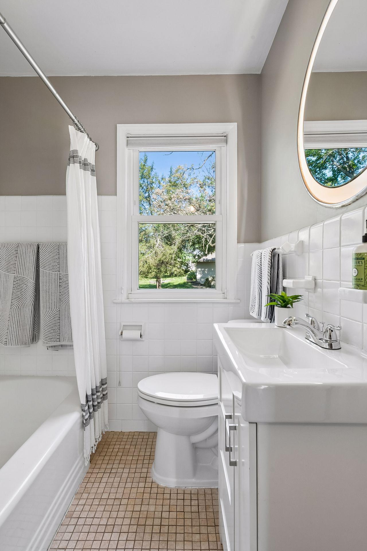 Main Floor Full Bathroom with North-facing window.