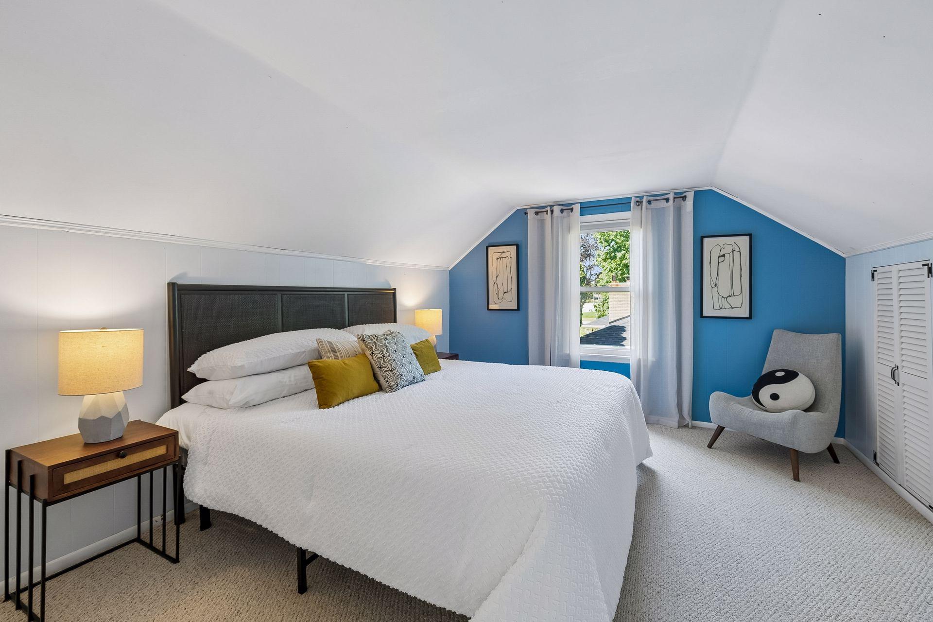 13x12 Upper Level bedroom #2 with White trim and Carpeted floors.