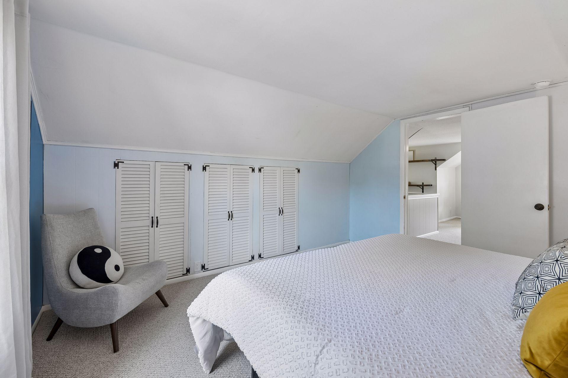 13x12 Upper Level bedroom #2 with White trim and Carpeted floors.
