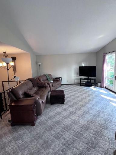 Main level living room with stone fireplace