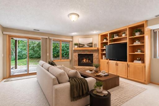 Walkout lower level with additional fireplace and entertainment center- VIRTUALLY STAGED