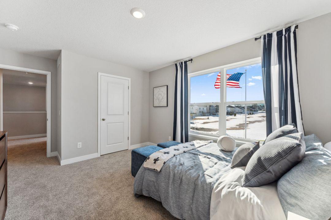 Another view of the bedroom. Photo of model home, colors and finishes are similar.