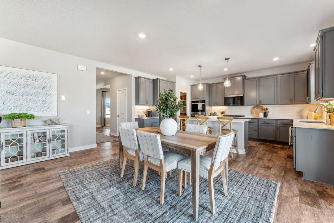 There's ample space for additional furniture, be it buffet or bookshelves. Photo of model home, colors and finishes are similar.